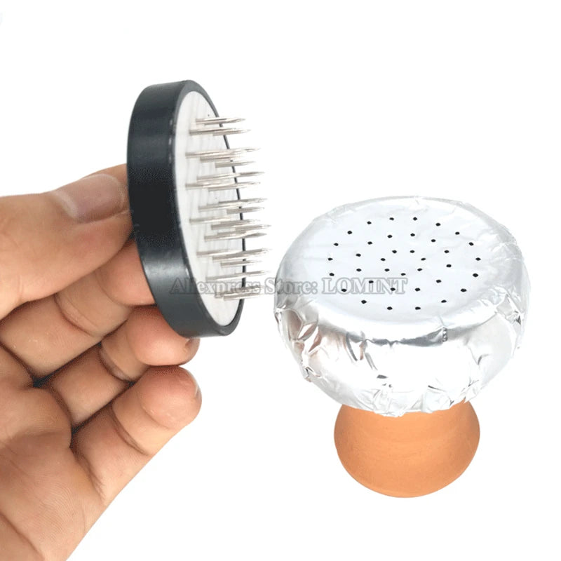 Hookah foil poker tool in use on bowl, creating perfect holes in aluminum foil, easy setup for optimal airflow and heat distribution