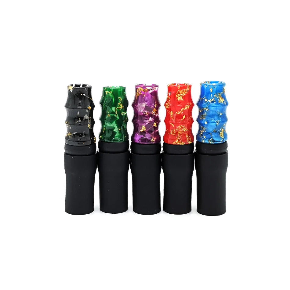 Five colorful resin mouthpeices with black bases on a white background